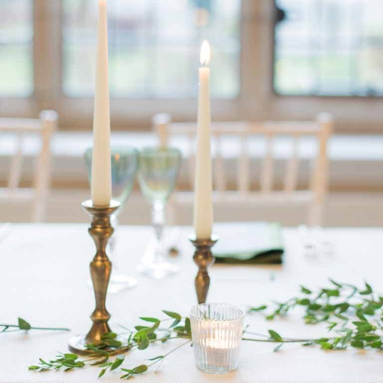 http://www.theweddingofmydreams.co.uk/cdn/shop/files/brass-bronze-candlestick-holders-wedding-table-decorations-for-sale-the-wedding-of-my-dreams.jpg?v=1696858358