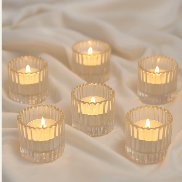 Set of 6 ribbed clear glass tealight holders with lit candles on a soft fabric background, labeled 'Perfect for Weddings'.